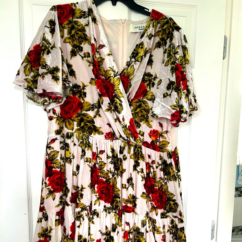 Velvety light pink with red flowers and green leaves